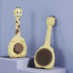 شانه و برس گربه تخلیه‌دار طرح زرافه زرد